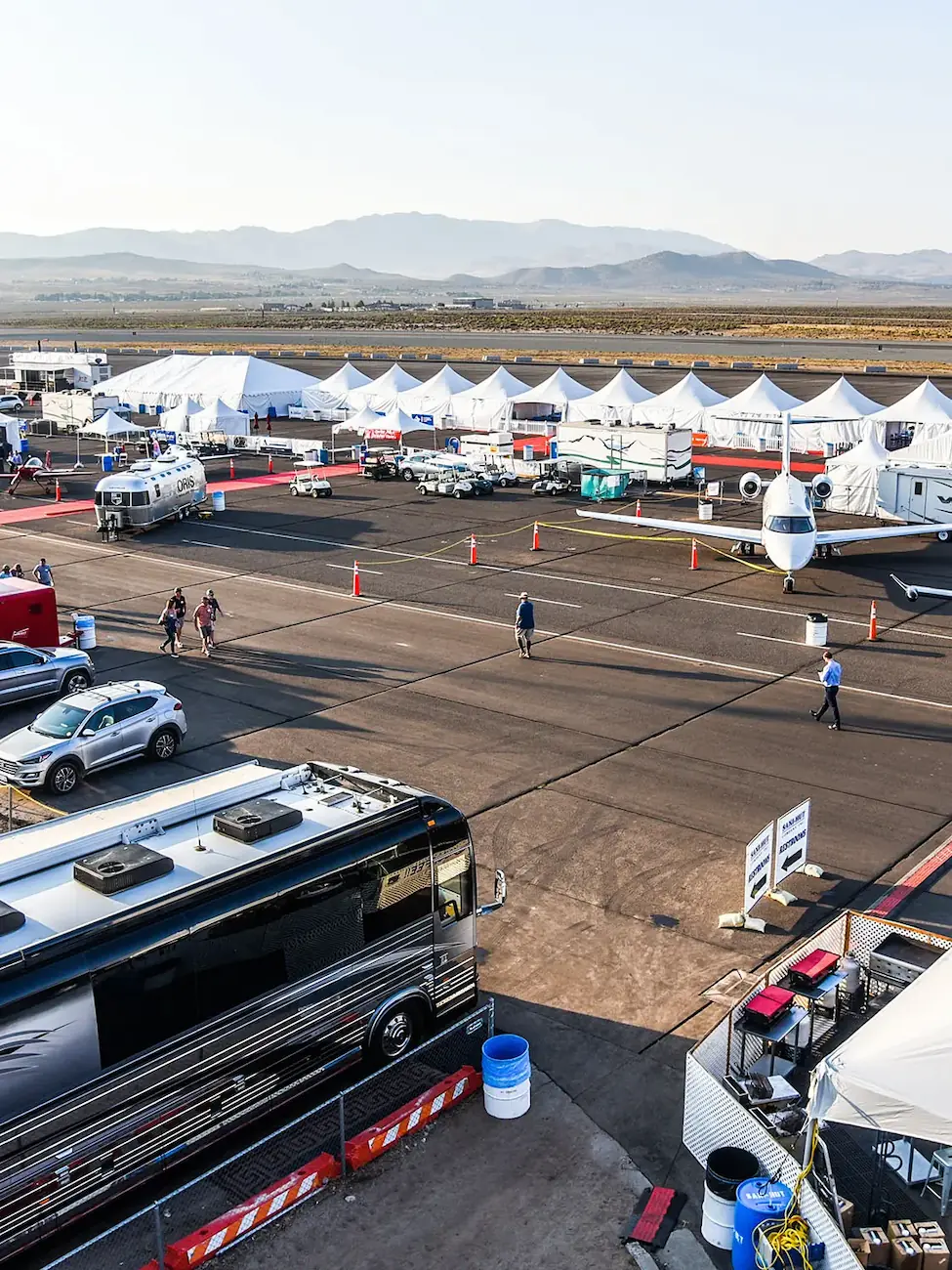 tarmac with tents and planes set up on it