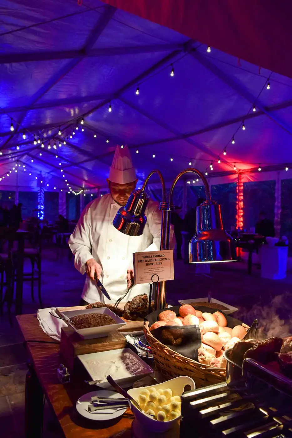 Chef cutting meat at a company function