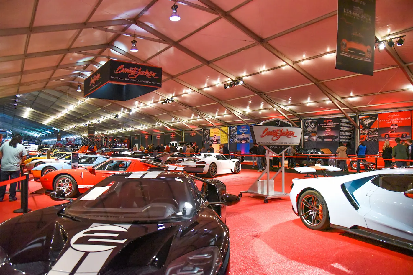 Car exhibition inside a large tent