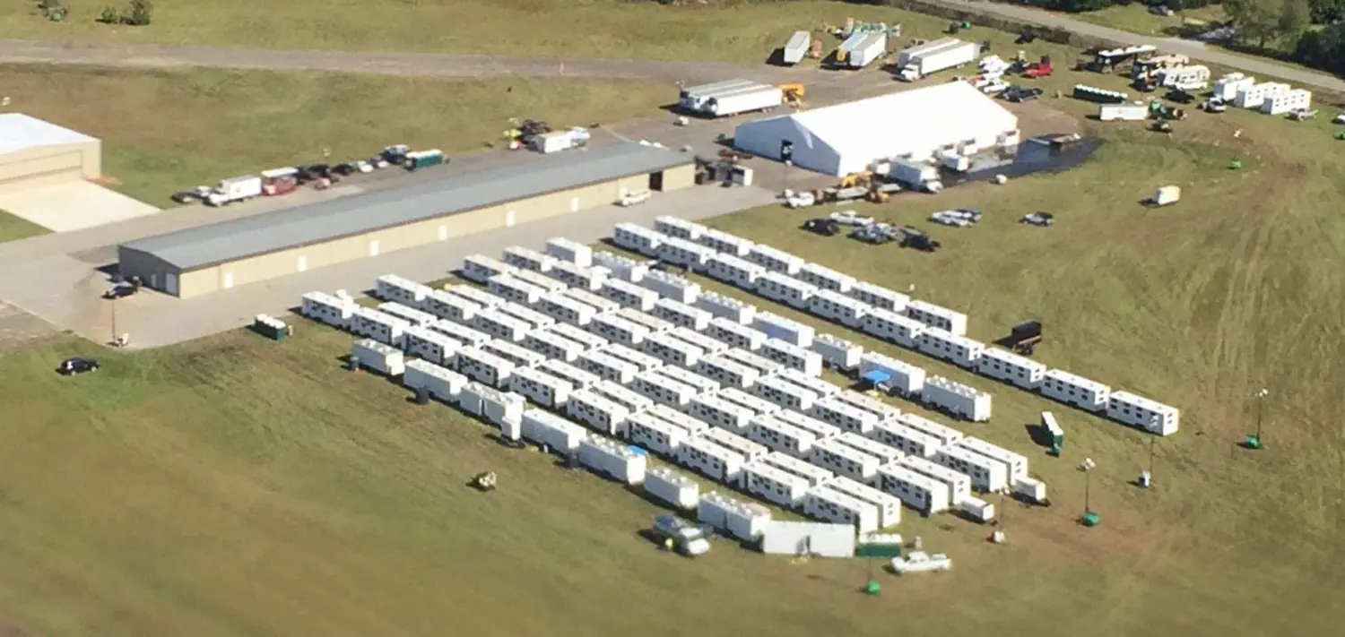 Aerial shot of dozens of emergency deployment trailers lined up next to each other