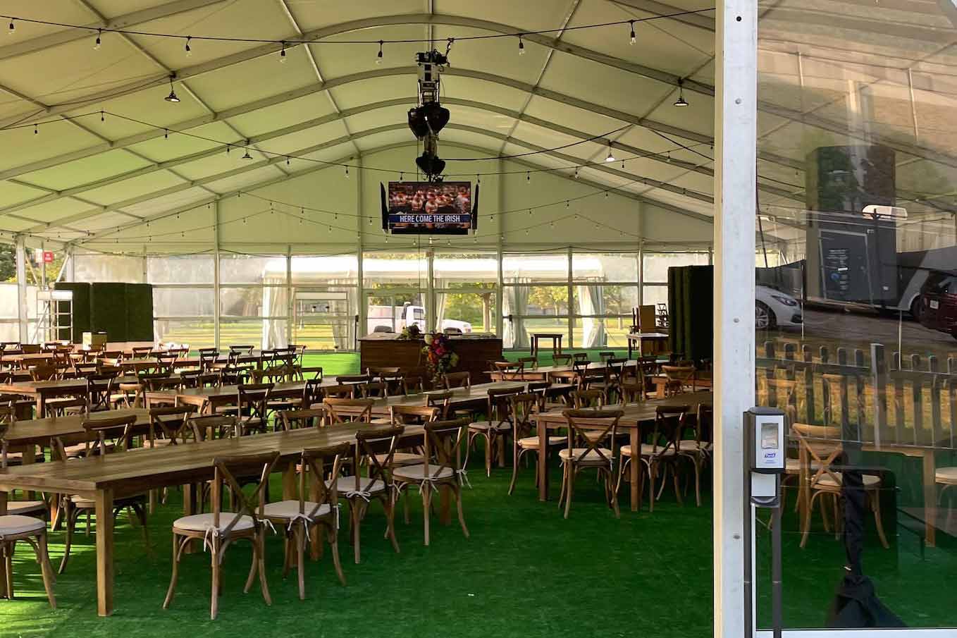 Dining space inside a tent for college sport event