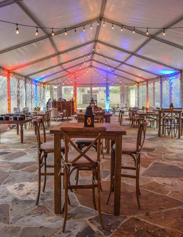 Event reception with rustic wooden tables and chairs