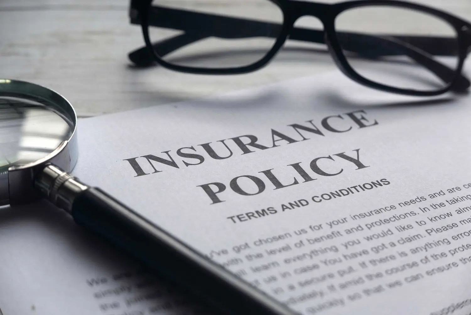 Paper with the words "Insurance Policy" written on it