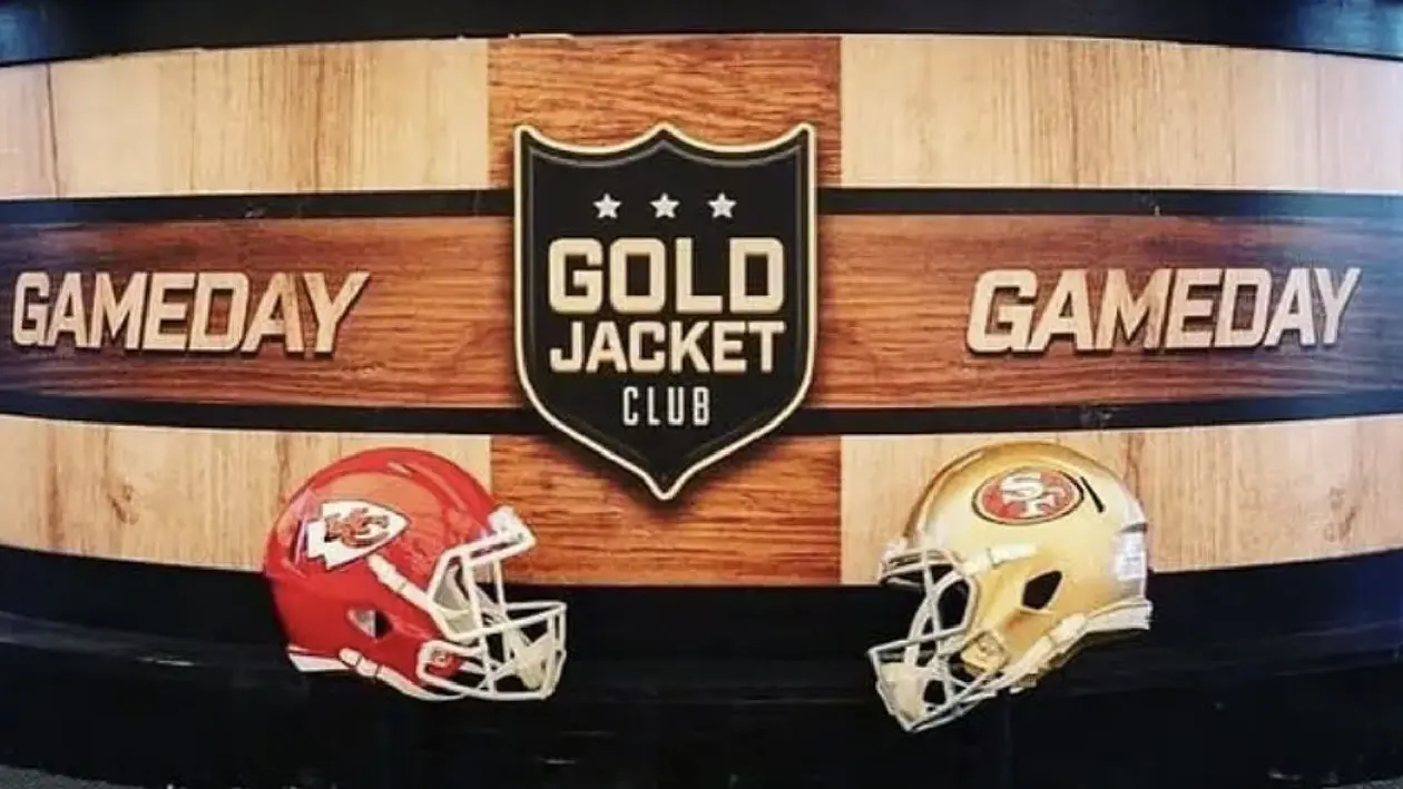 Two football helmets facing each other, the left one Kansas City, the right one San Francisco