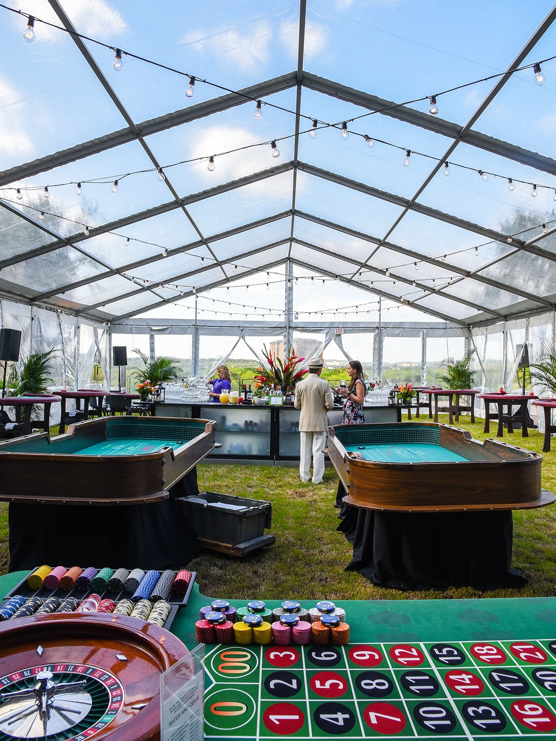 Large clear top tent structure covering gambling games