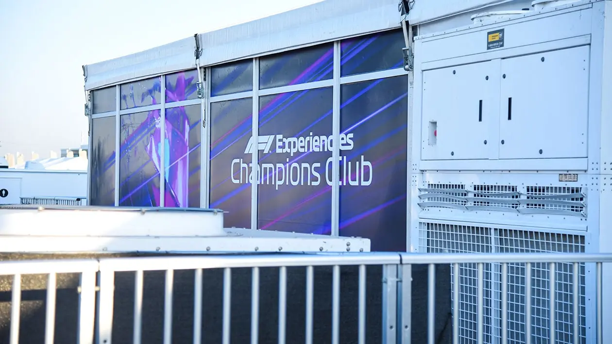 Big windows with wrap on it saying "F1 Experiences Champions Club"