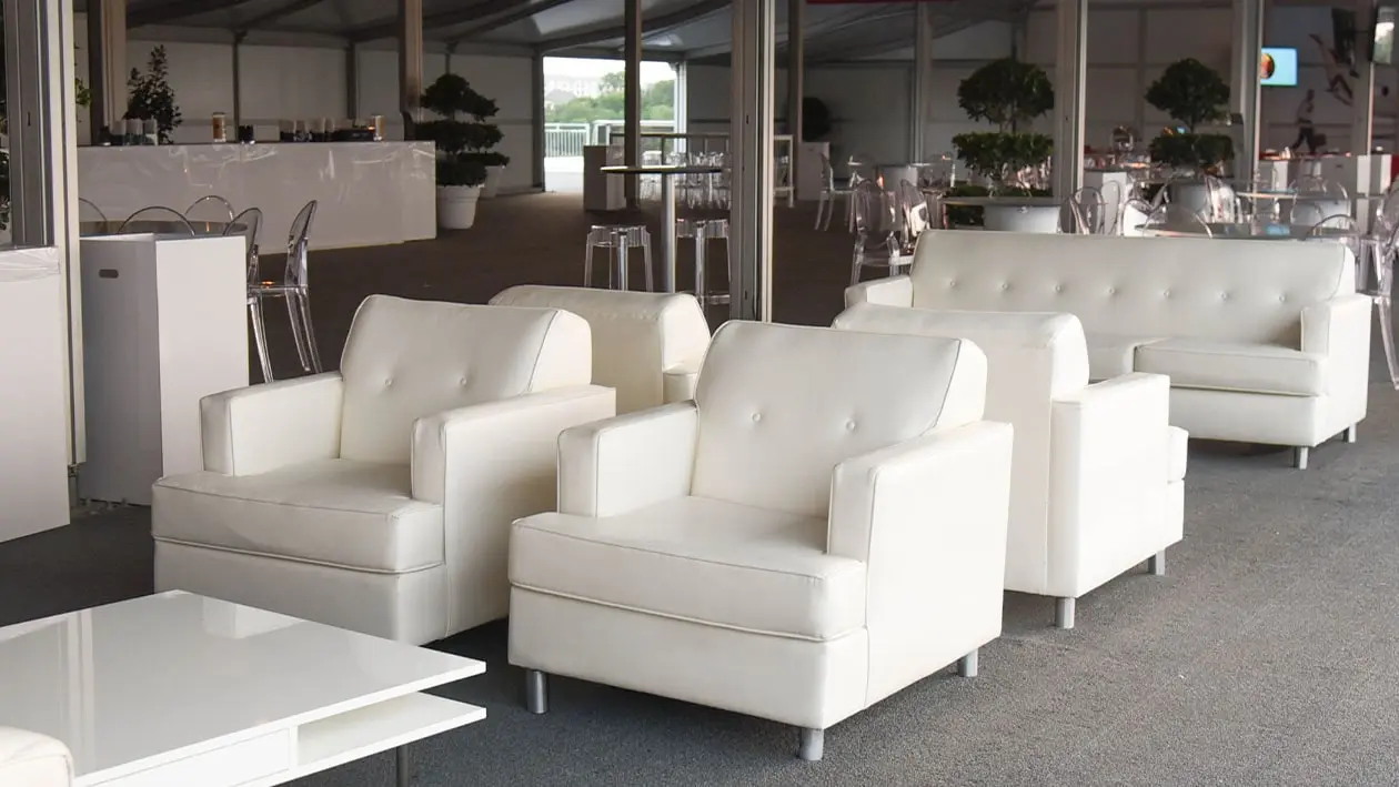 White Sofa Chairs set up in large room