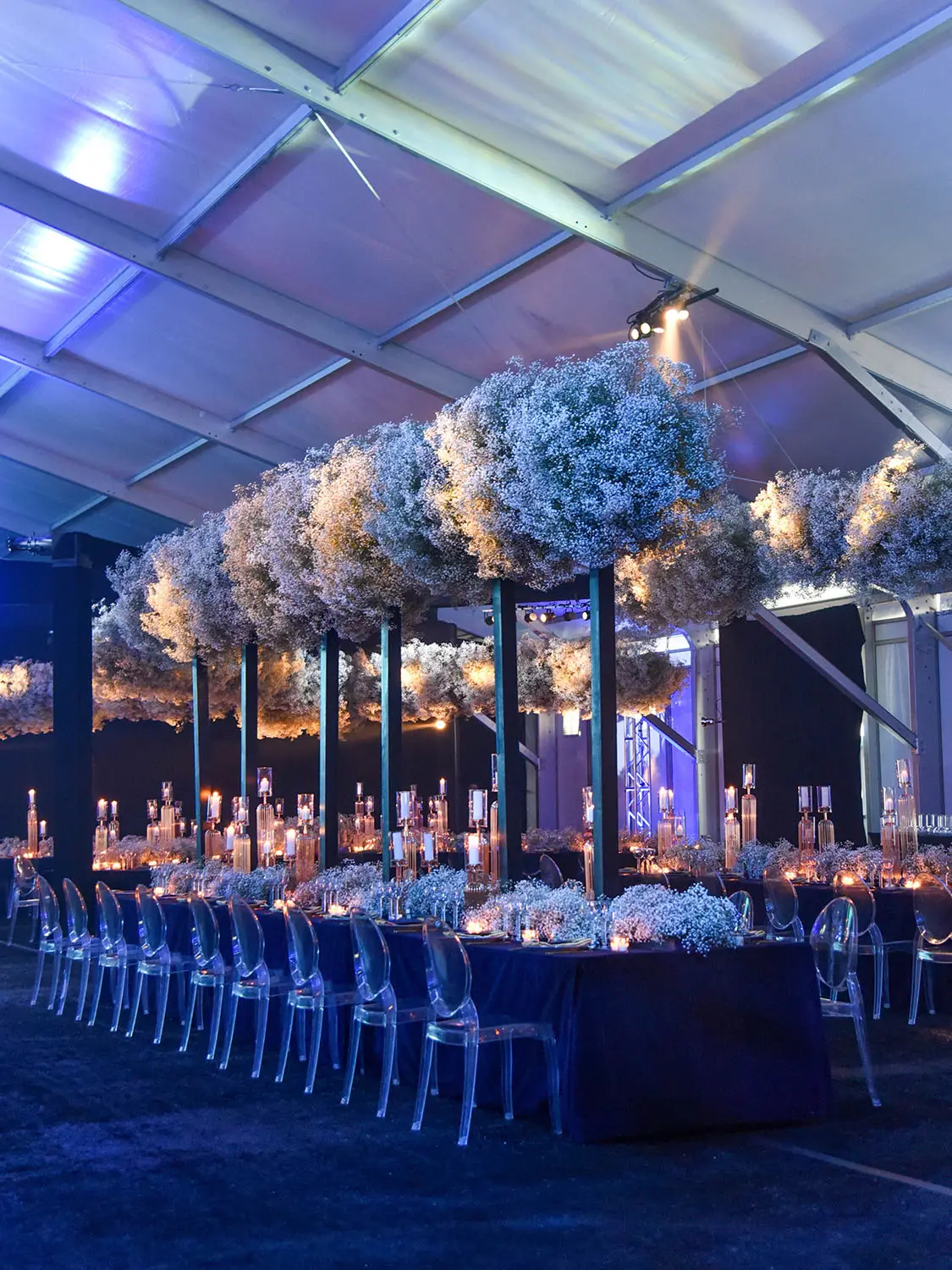 Large Tent with themed dining room set up on long tables