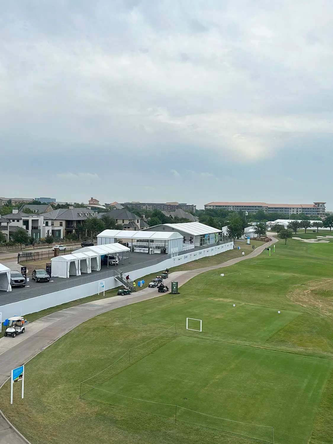 Golf Course green with tents set up along side it