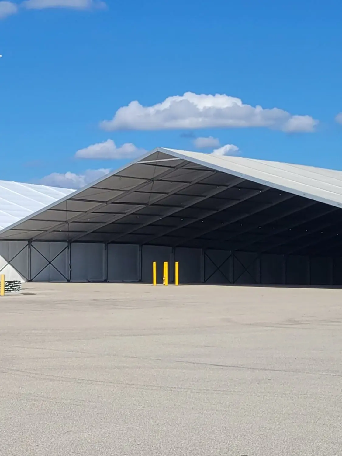 Large 50 Meter tent with open side in parking lot